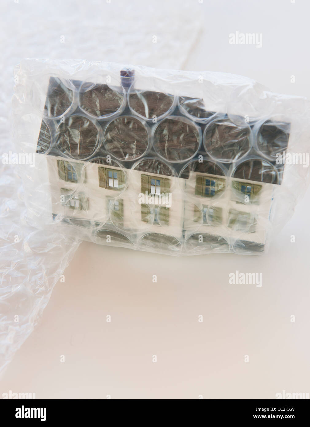 Studio shot of house wrapped in bubble wrap Stock Photo Alamy