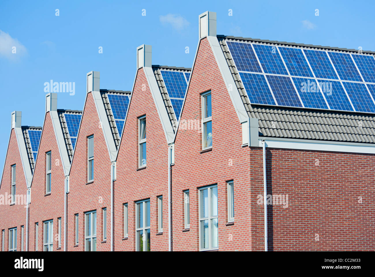 Modern Dutch houses with solar panels on roof Stock Photo