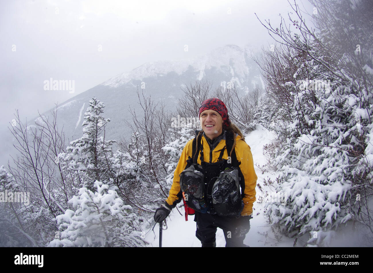Mountaineer climbing up Mount Washington in the winter Stock Photo