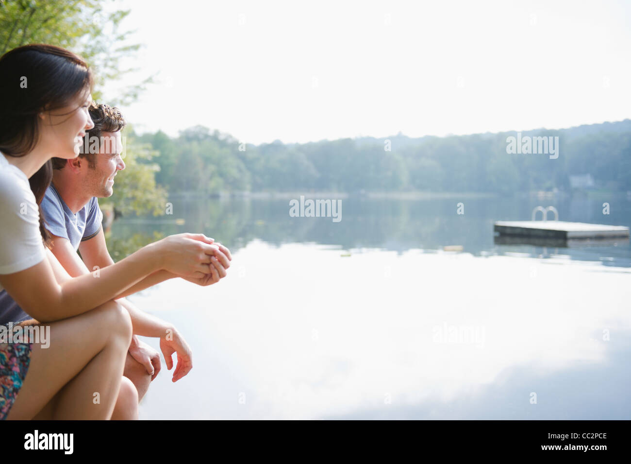 USA, New York, Putnam Valley, Roaring Brook Lake, Couple sitting by