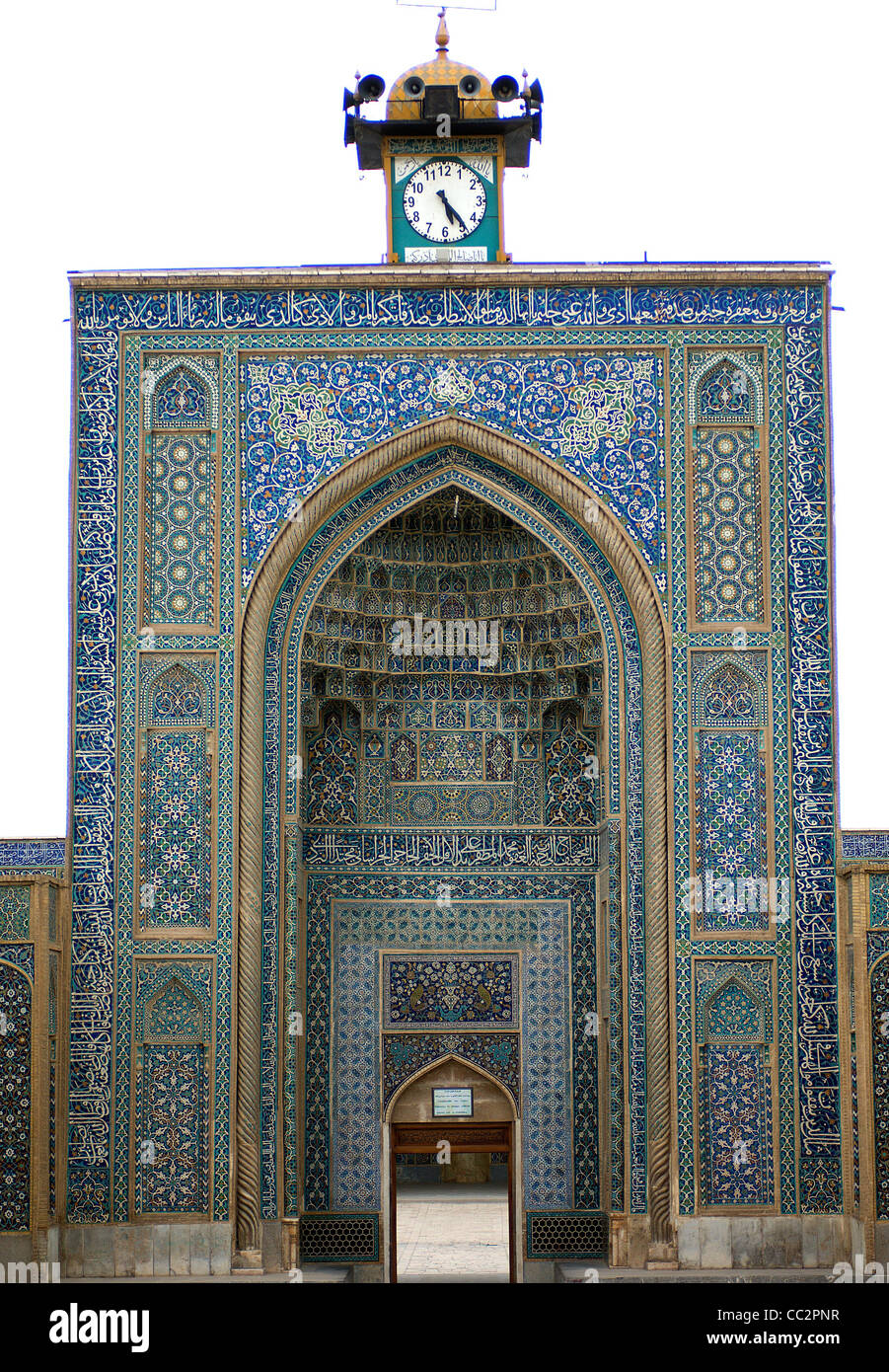 The shimmering blue tiles on the Jameh (Friday) Mosque at Kerman, Iran, date from the 14th century. The clock-tower is unusual. Stock Photo