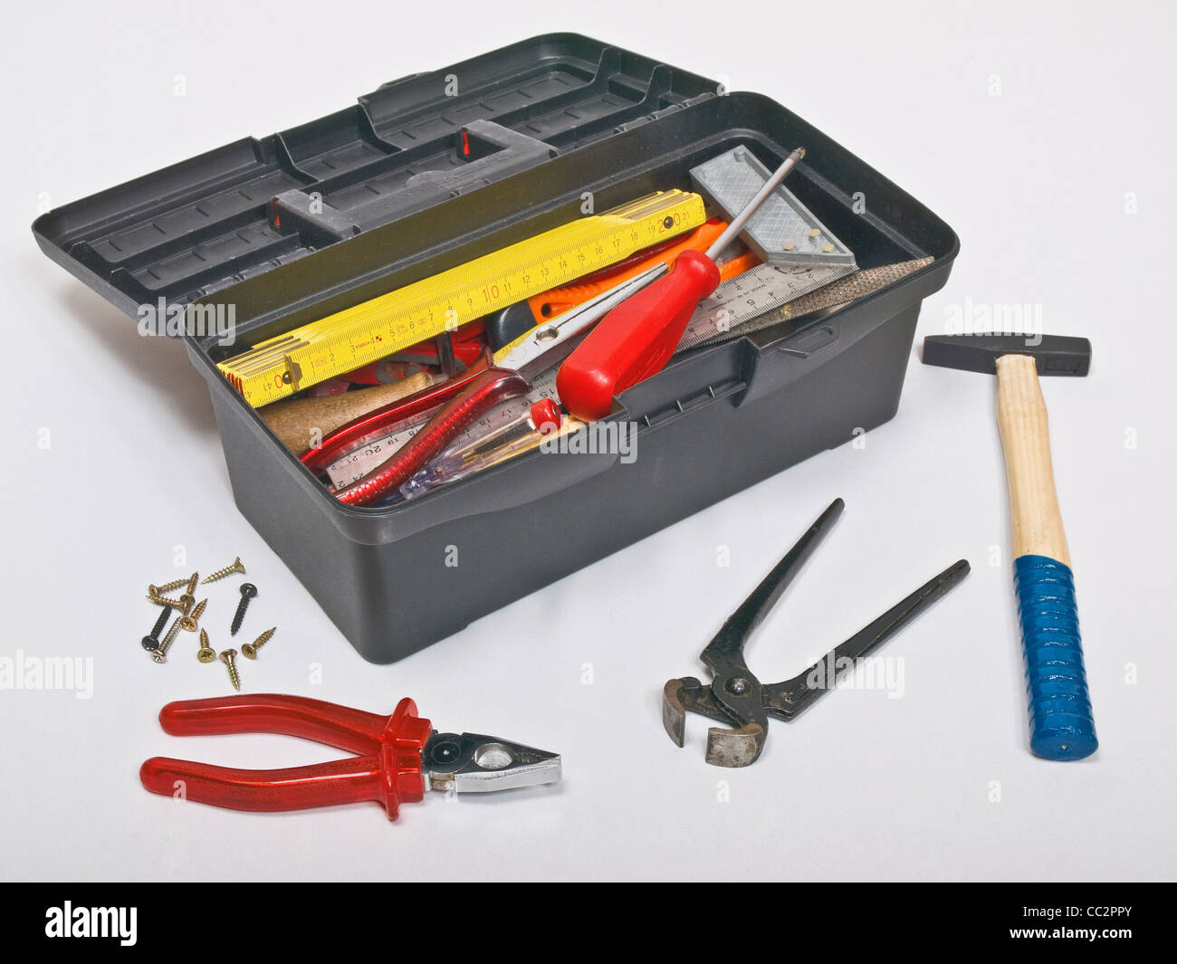 Detail photo of a opened Toolbox, alongside are tools Stock Photo
