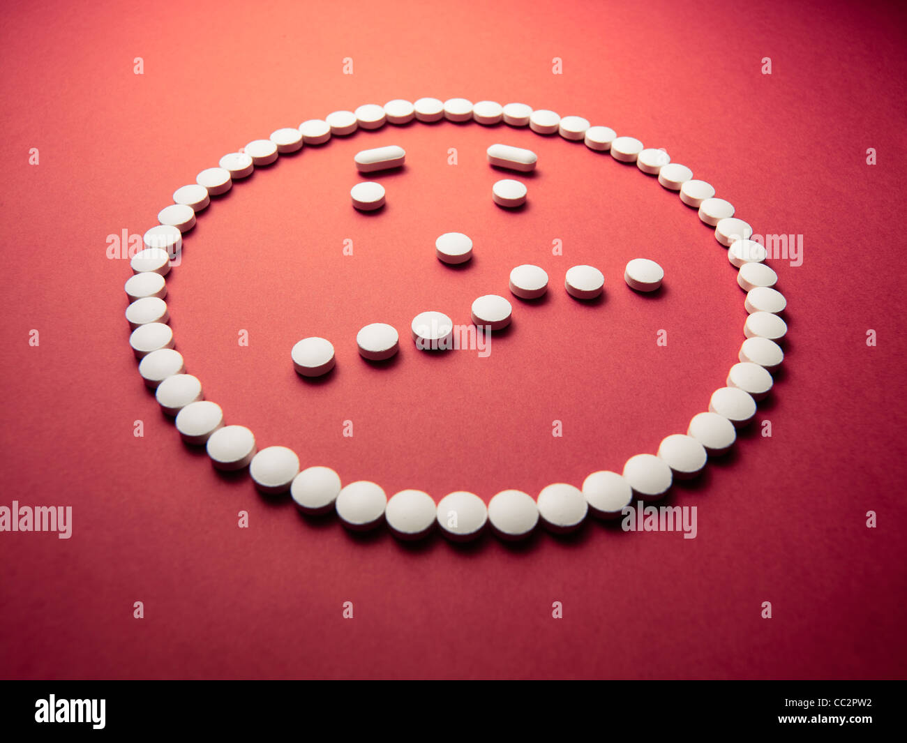 puzzled  face made out of pills and drugs Stock Photo