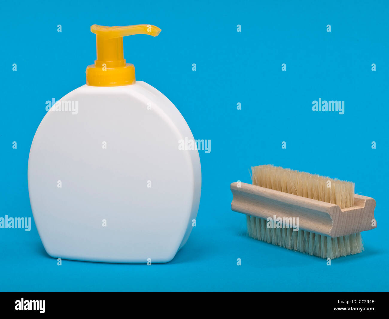 Detail photo of a liquid soap, besides is a Nailbrush Stock Photo
