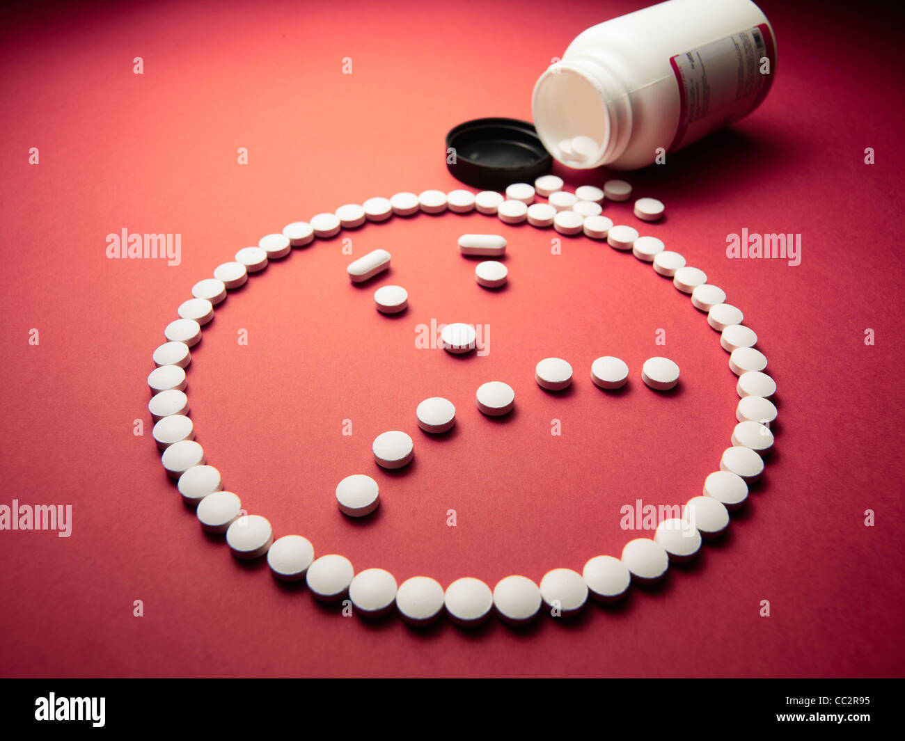 unhappy face made out of pills and drugs Stock Photo