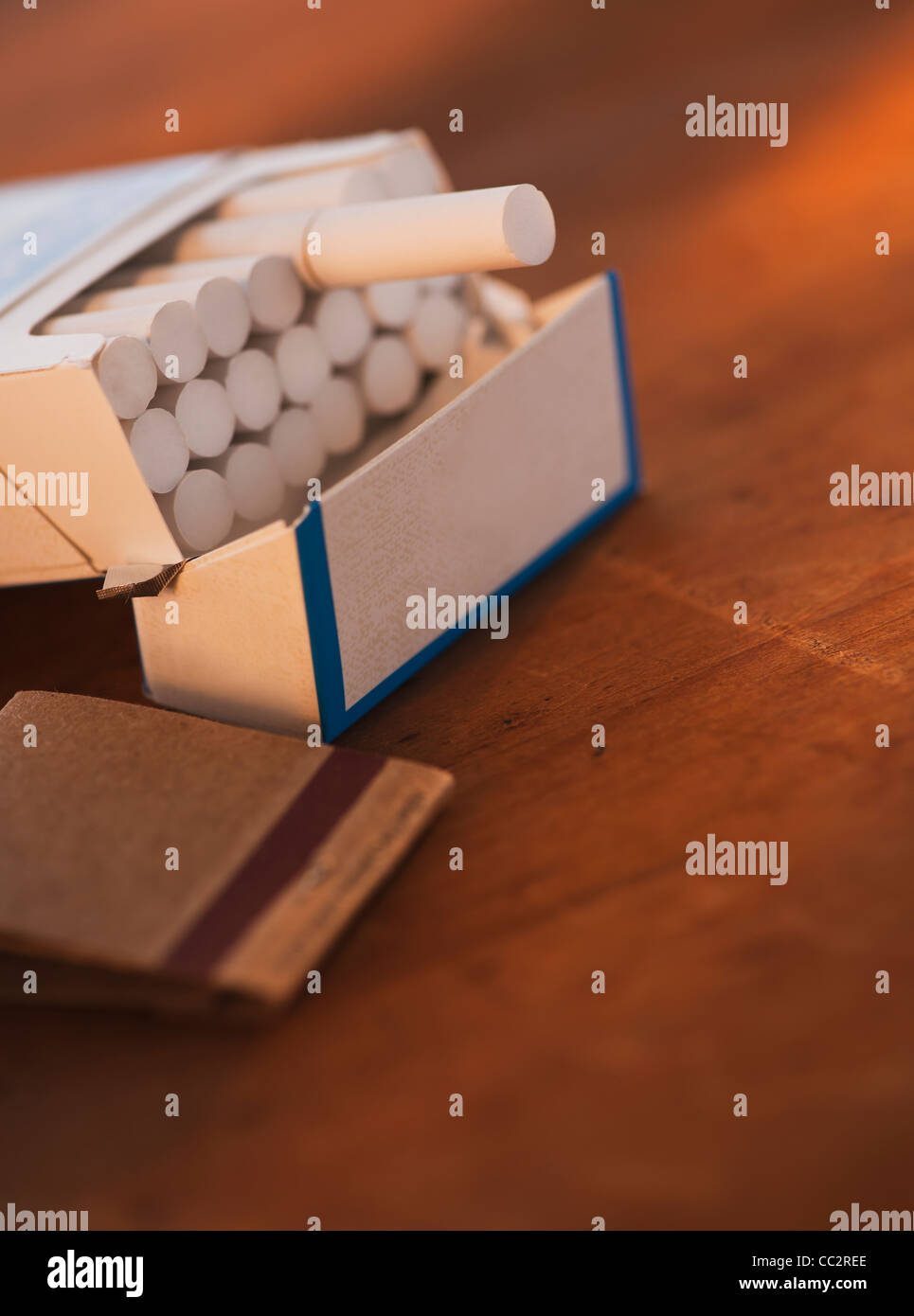 Close up of open cigarette pack and matches Stock Photo