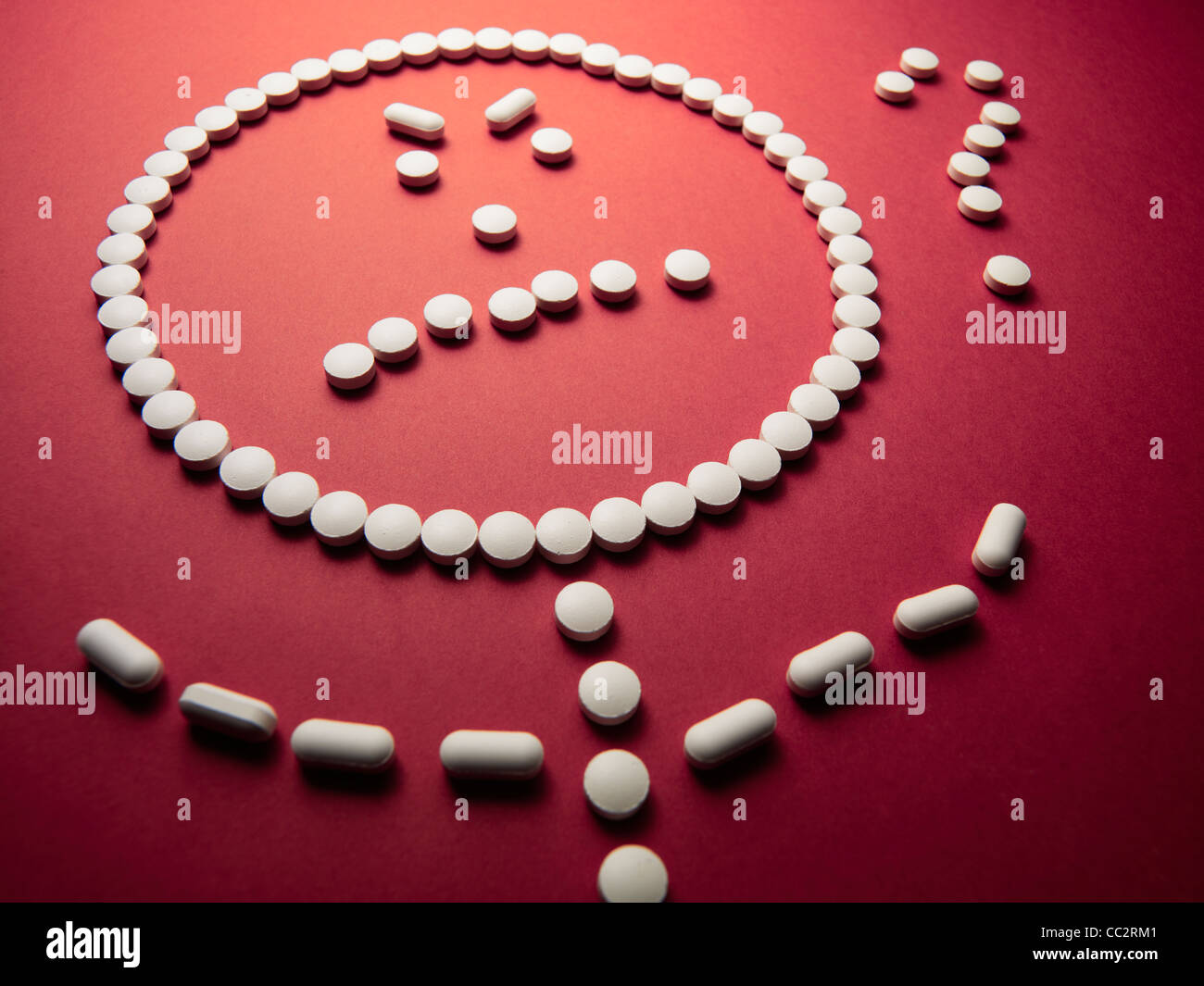 face made out of pills and drugs frustrated with question mark red background Stock Photo