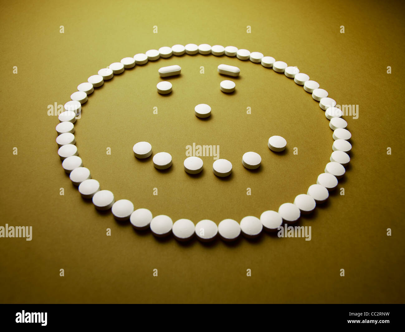 Happy contented face made out of pills and drugs Stock Photo