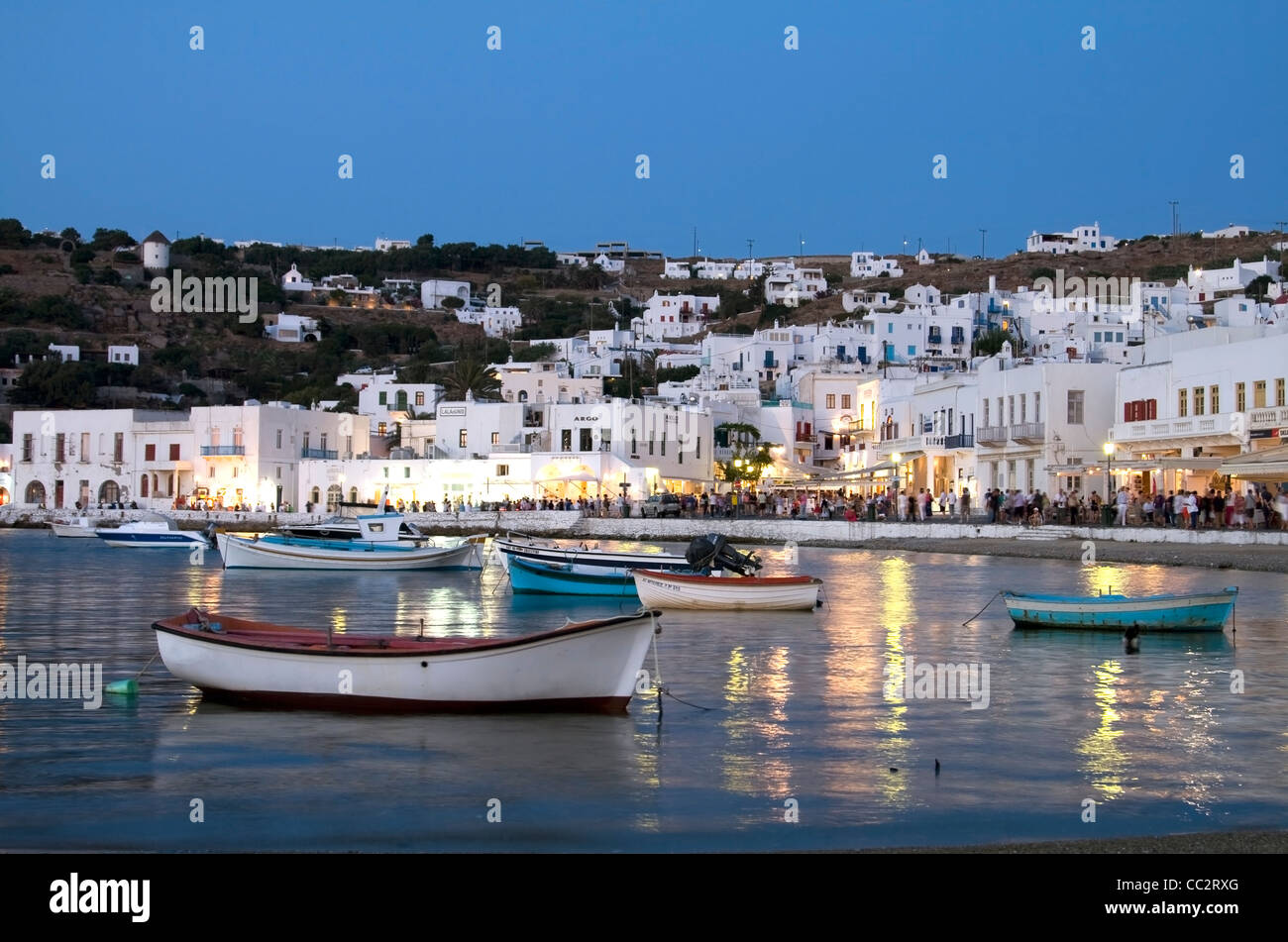 Fishing boats in the harbour at Mykonos Old Town at dusk, Cyclades Stock Photo