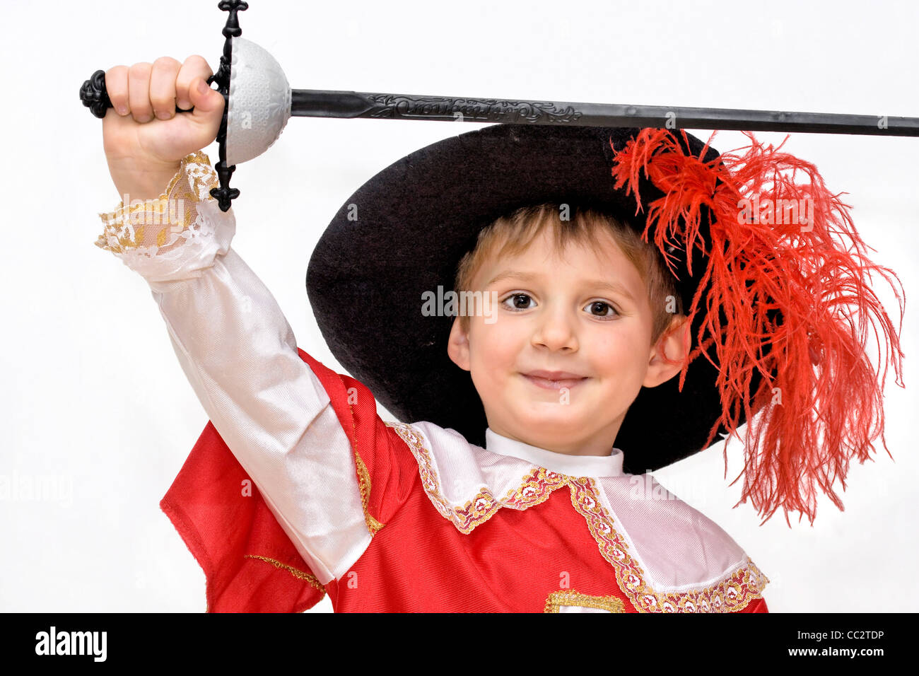 Boy with carnival costume . Little fighting musketeer. Stock Photo