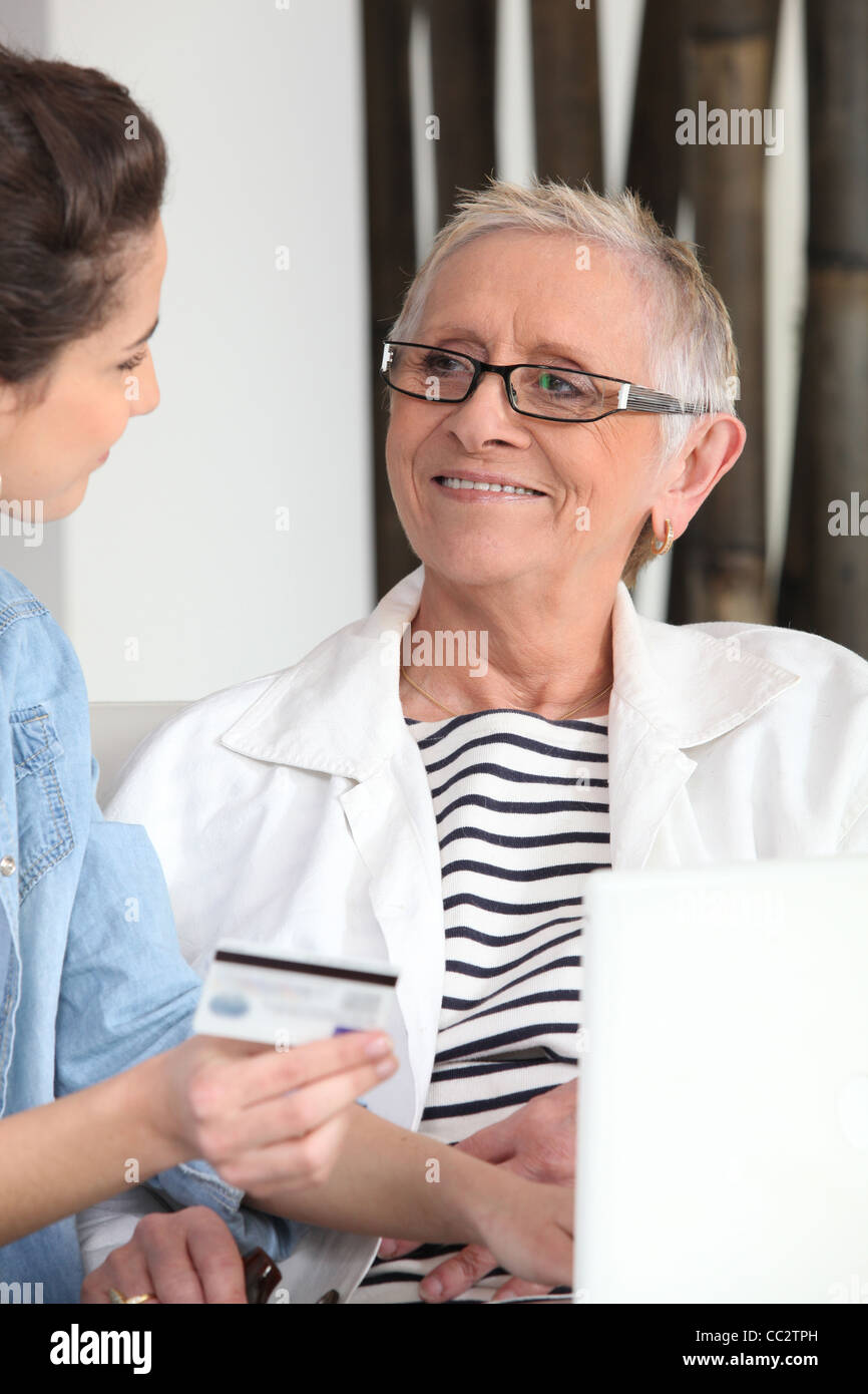 Mother and daughter shopping online Stock Photo Alamy