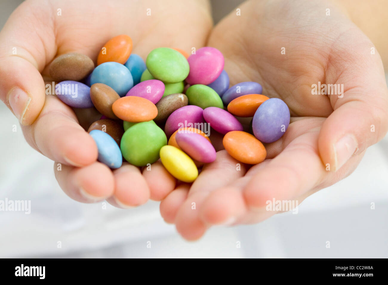Childs Hands Holding Candy Sweets Stock Photo Alamy