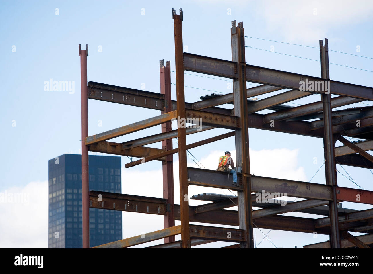 USA, New York City, Construction worker sitting on unfinished structure