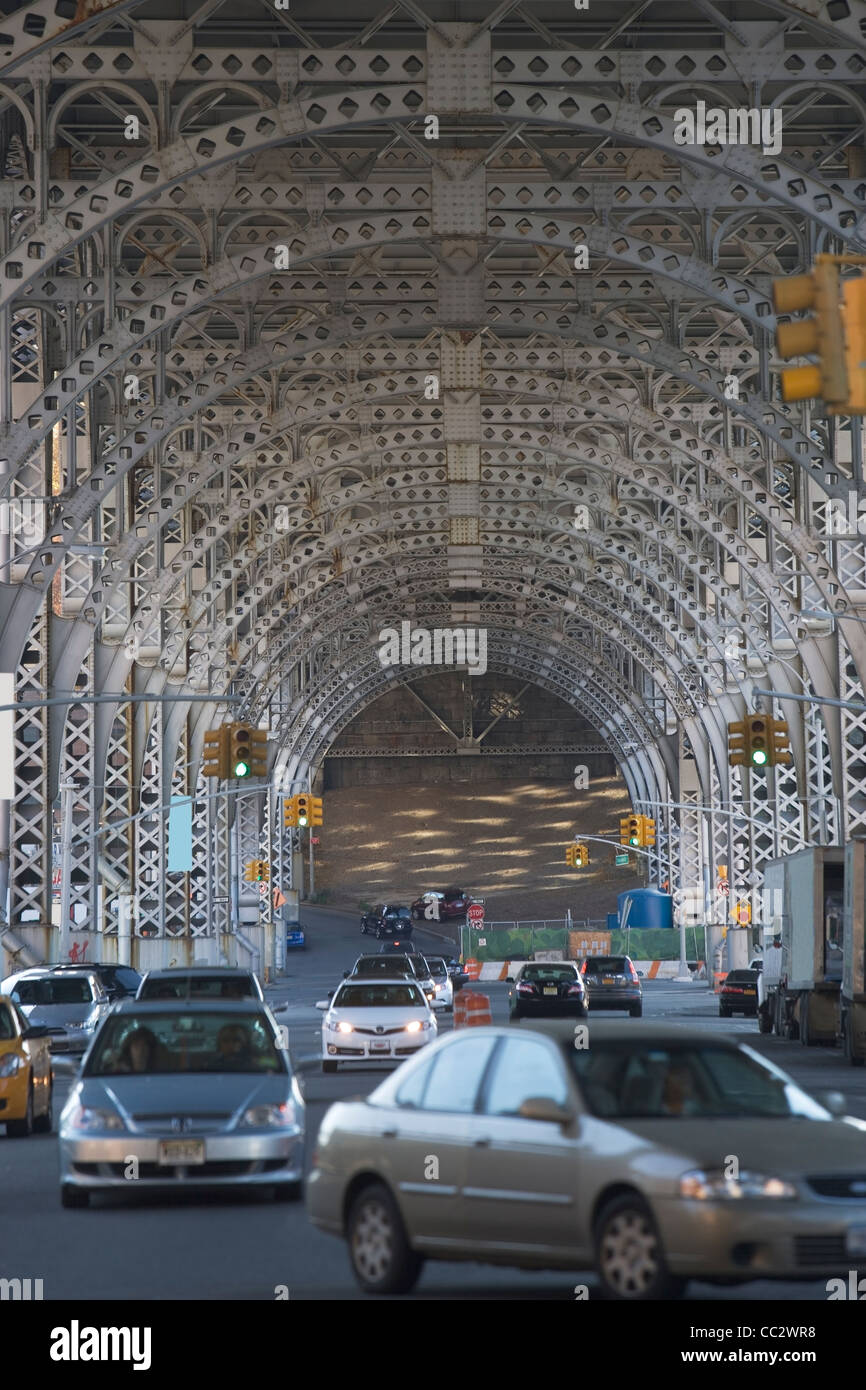 USA, New York City, Traffic passing under bridge Stock Photo