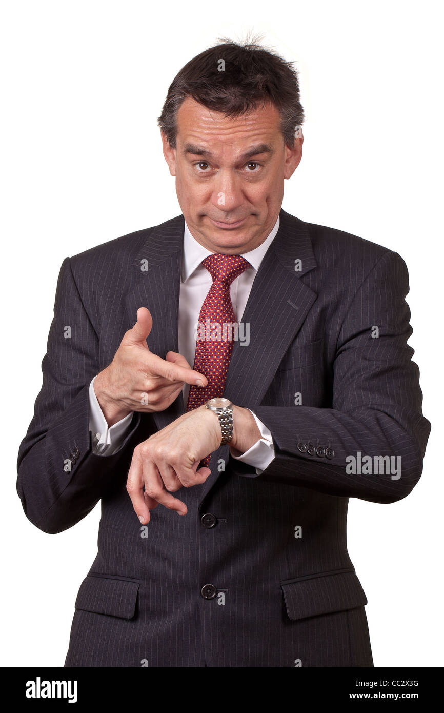 Attractive Middle Age Business Man in Suit Pointing at Watch Stock Photo