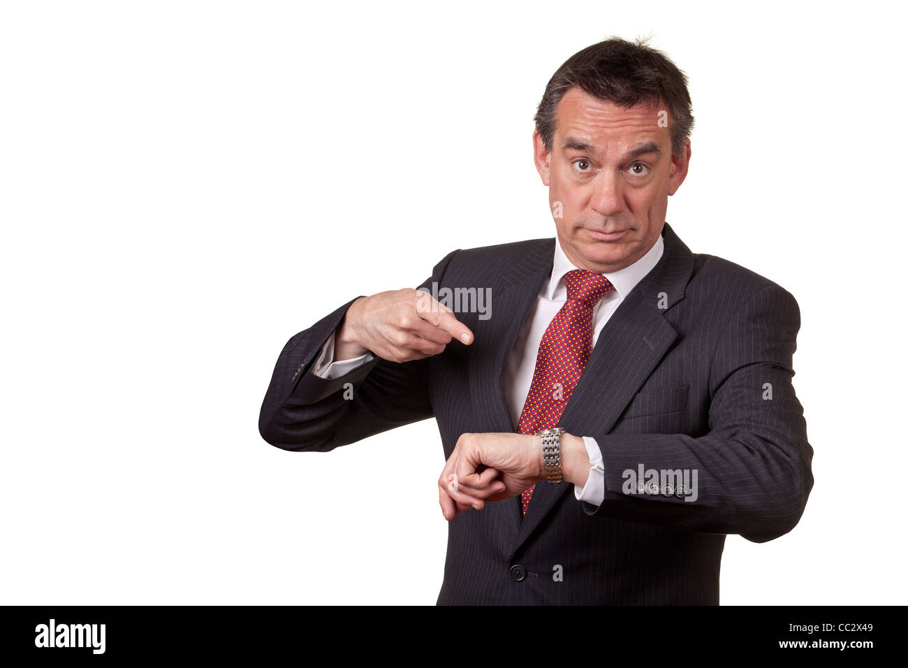 Annoyed Angry Middle Age Business Man Pointing at Time on Watch Stock Photo