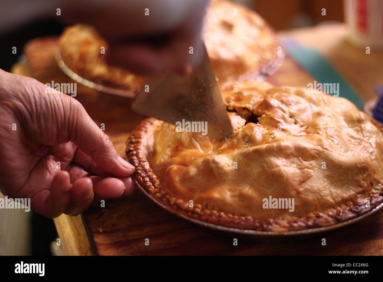 Homemade apple pie getting sliced Stock Photo
