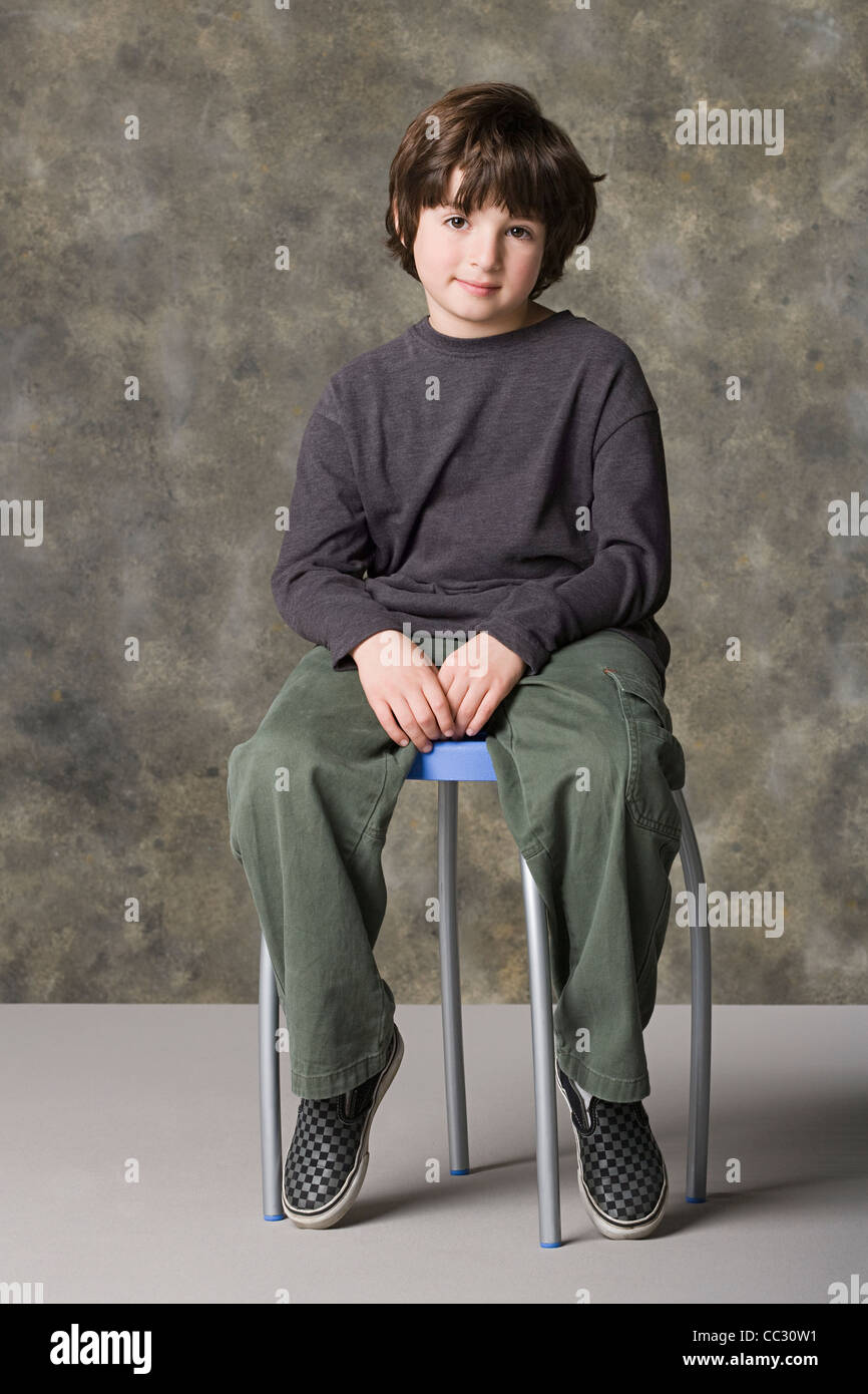 Studio portrait boy on stool hi-res stock photography and images - Alamy