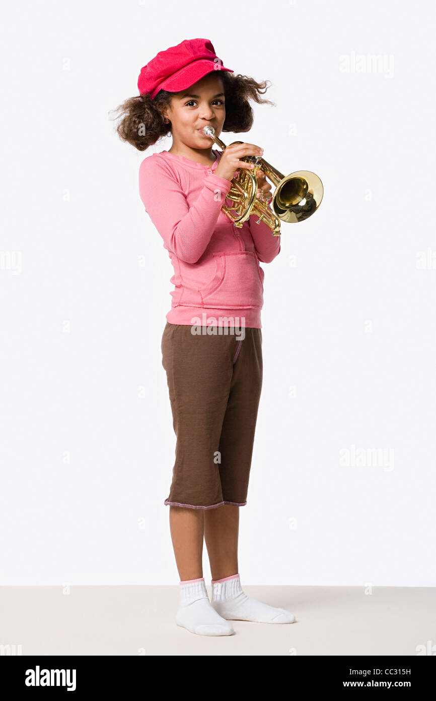 Girl playing trumpet hi-res stock photography and images - Alamy