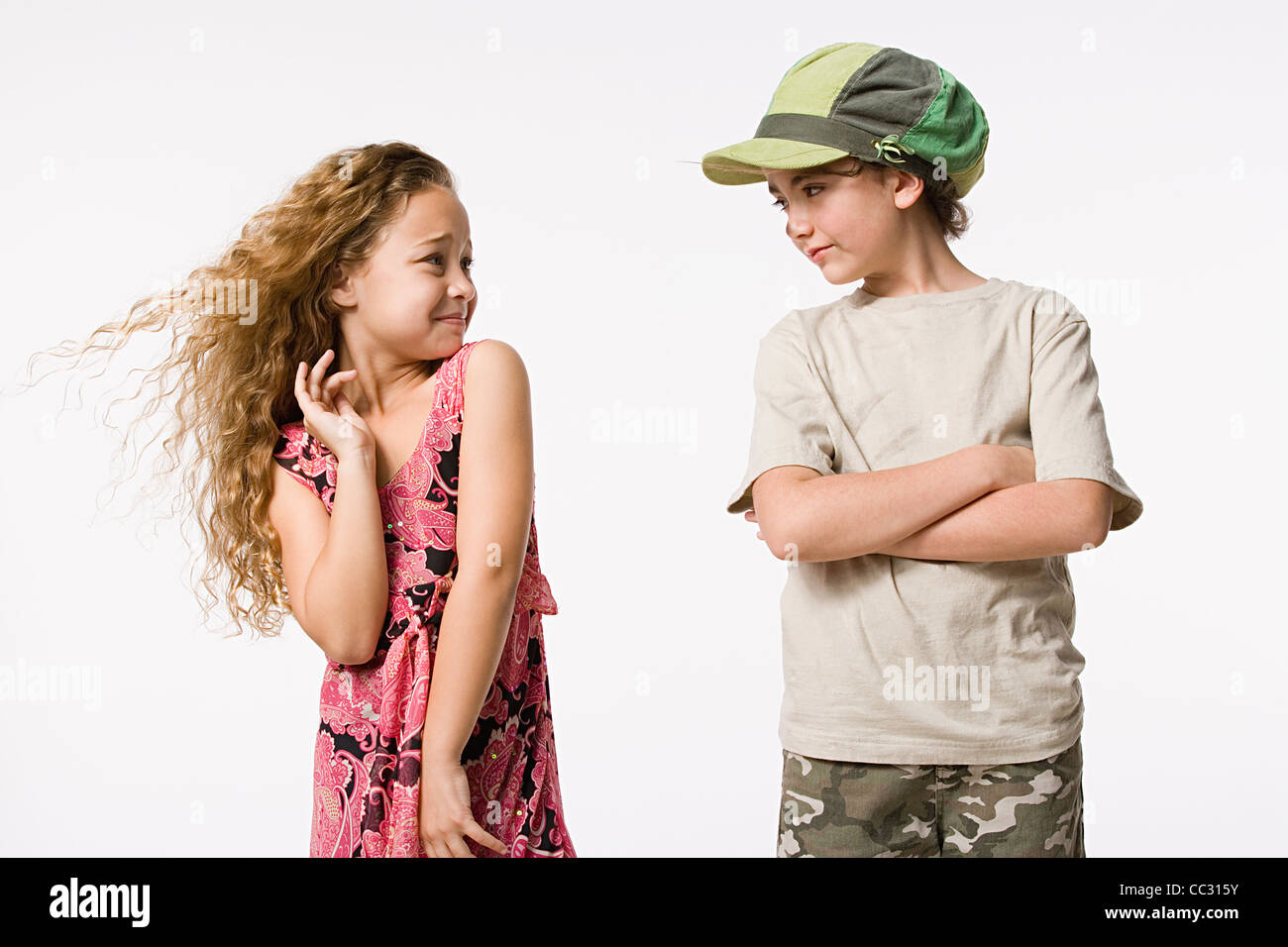 Studio portrait of two smiling girls (8-9 Stock Photo - Alamy