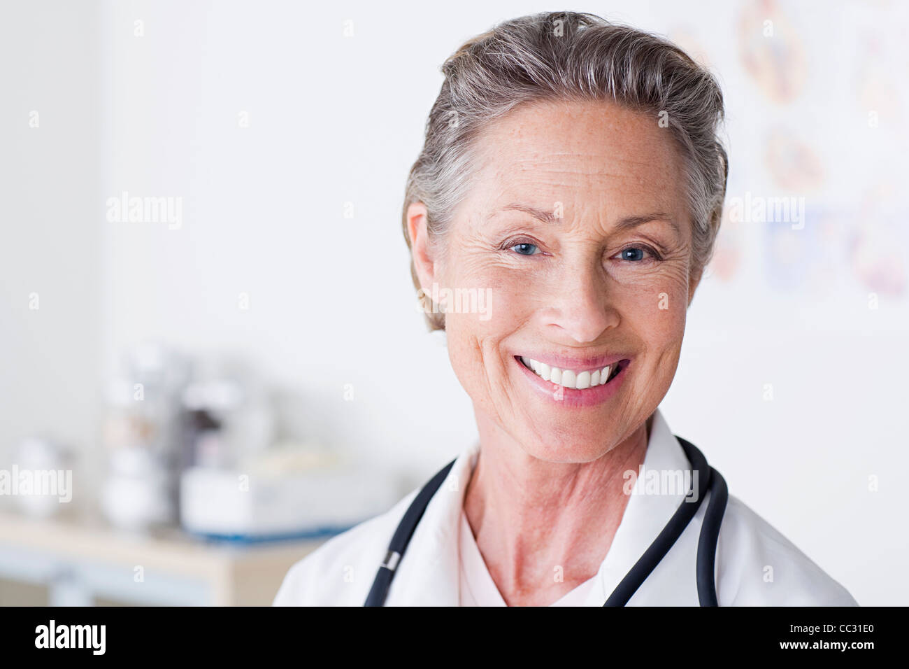 Happy smiling mature doctor hi-res stock photography and images - Alamy