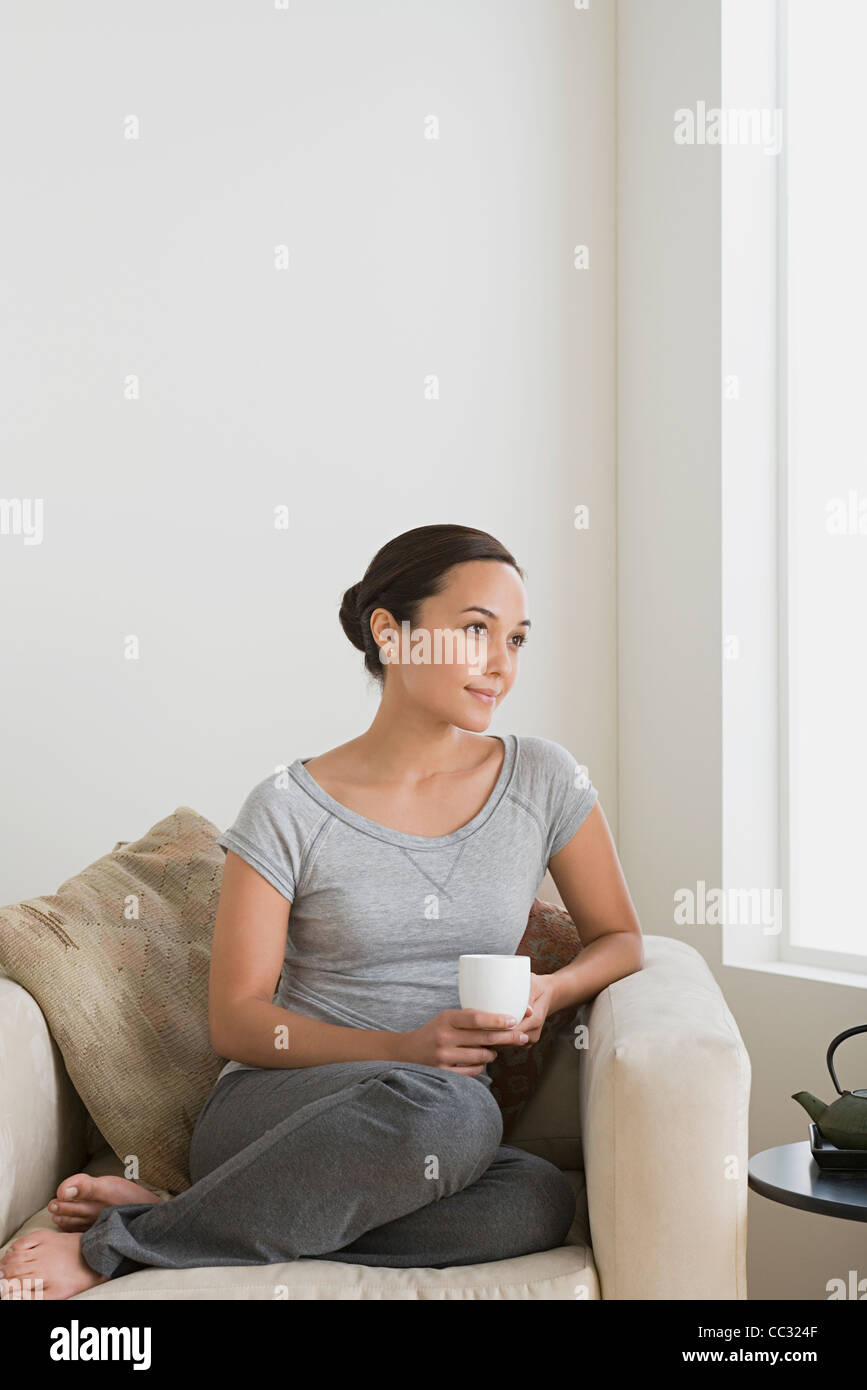 USA, California, Los Angeles, Woman relaxing at home Stock Photo