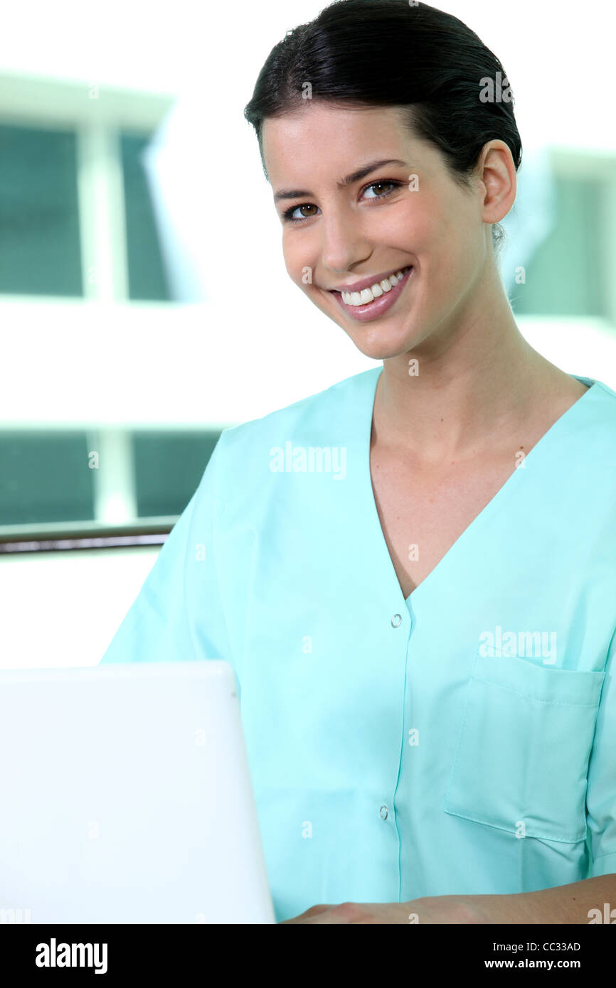 Friendly nurse in green scrubs Stock Photo Alamy