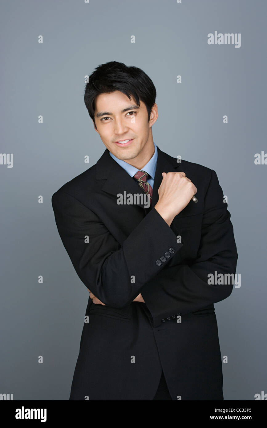 Portrait of happy young businessman Stock Photo - Alamy