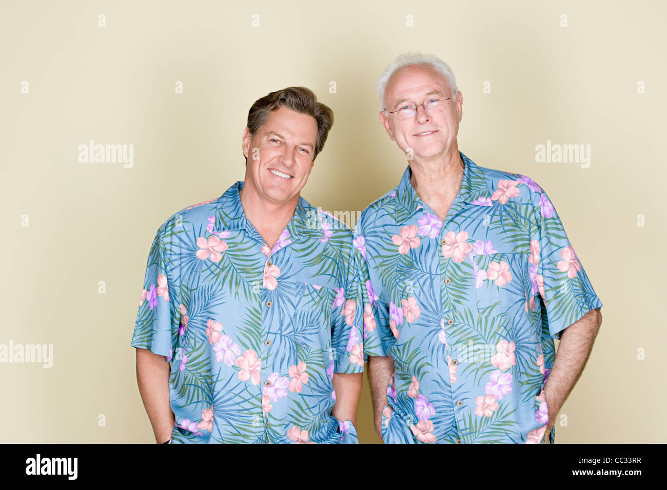 Portrait of father with adult son wearing Hawaiian shirts Stock Photo Alamy
