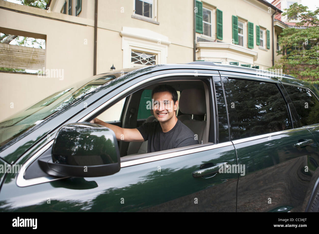 USA, New Jersey, Portrait of man driving car Stock Photo