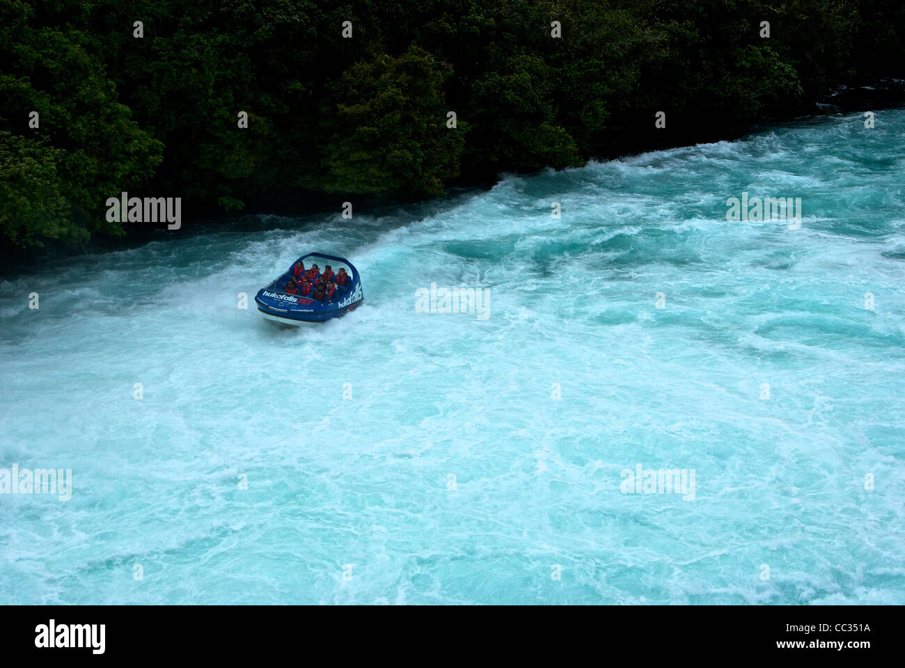 Jet boat tour turbulent whirling frothy currents of Waikato River below ...