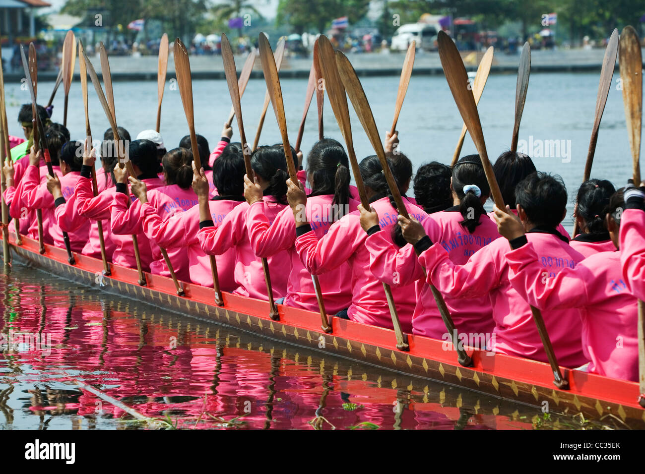 A female long-boat team at the Wax Castle Festival.  Sakhon Nakhon, Sakhon Nakhon province, THAILAND Stock Photo