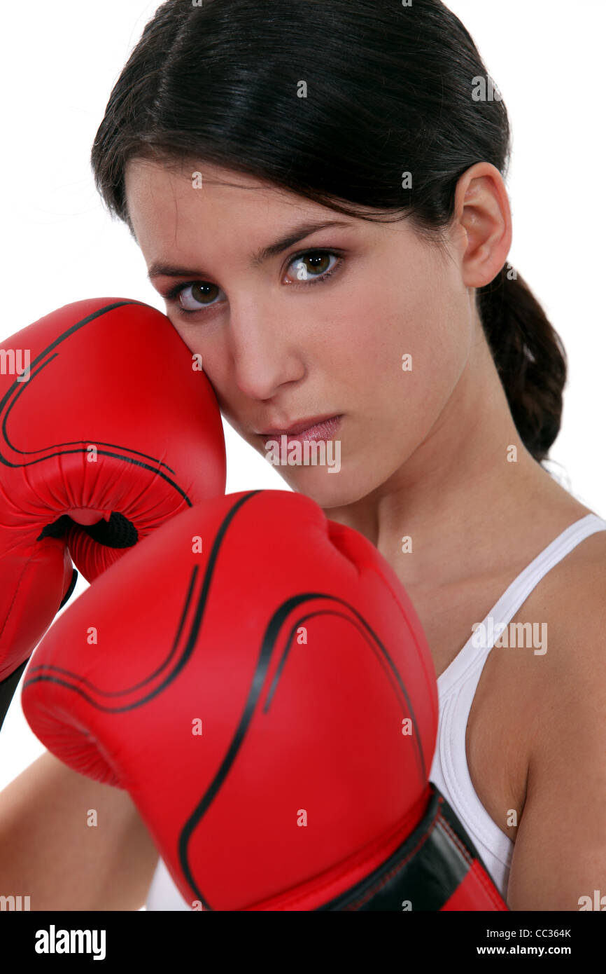 Tough woman with her boxing gloves Stock Photo