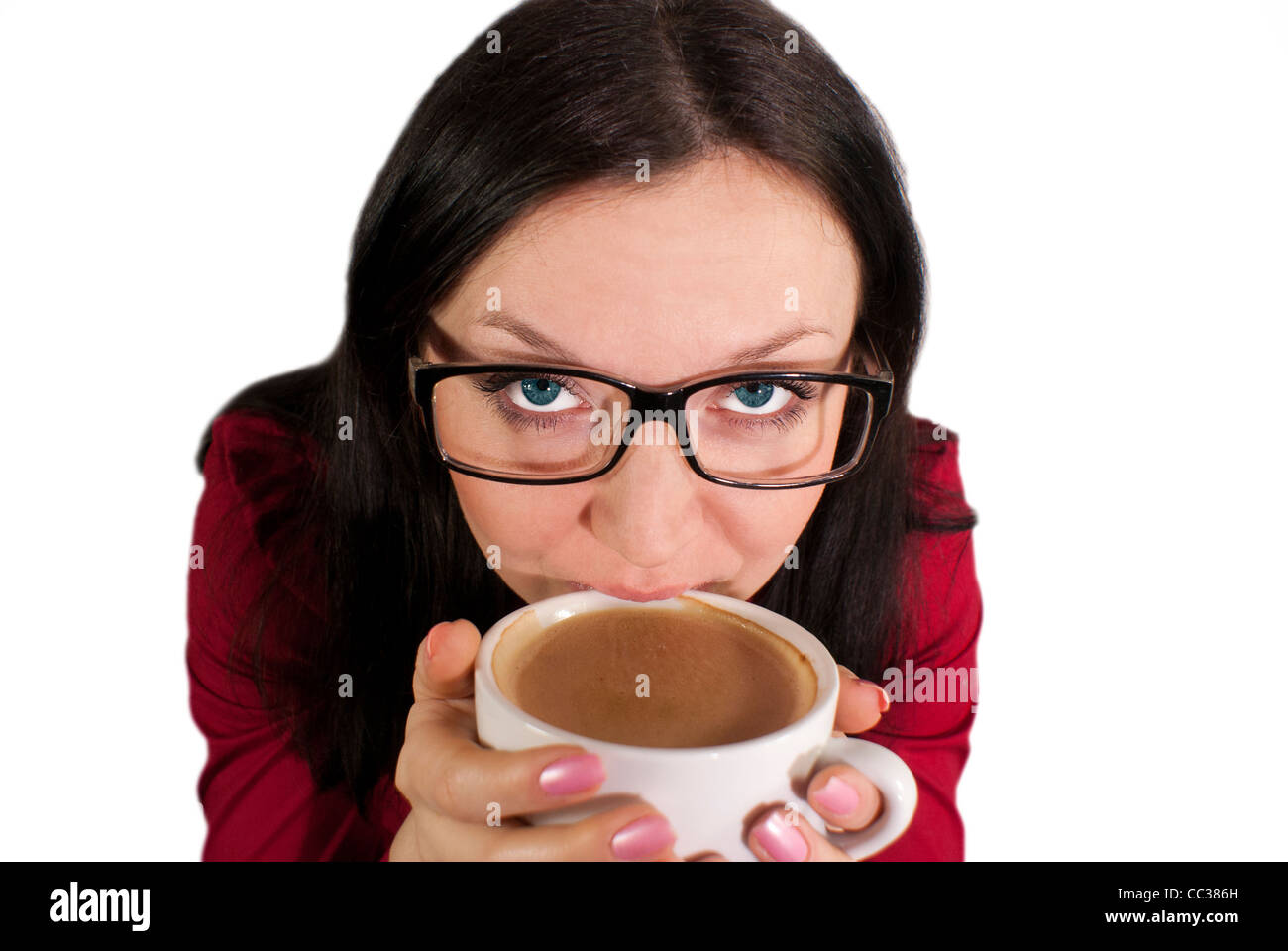 brunette girl with glasses trying to flavored coffee Stock Photo