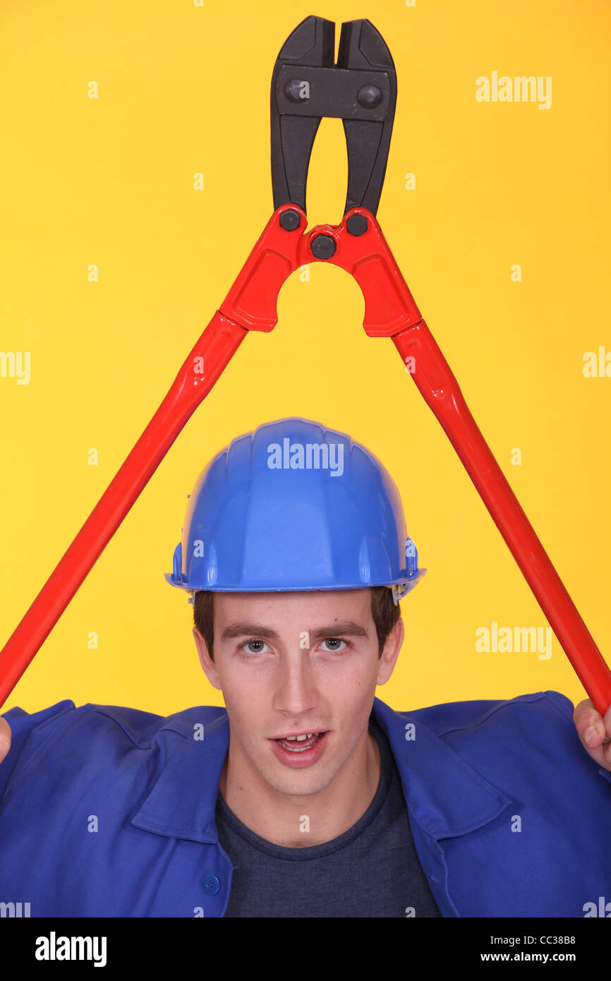 Man holding boltcutter over his head Stock Photo Alamy