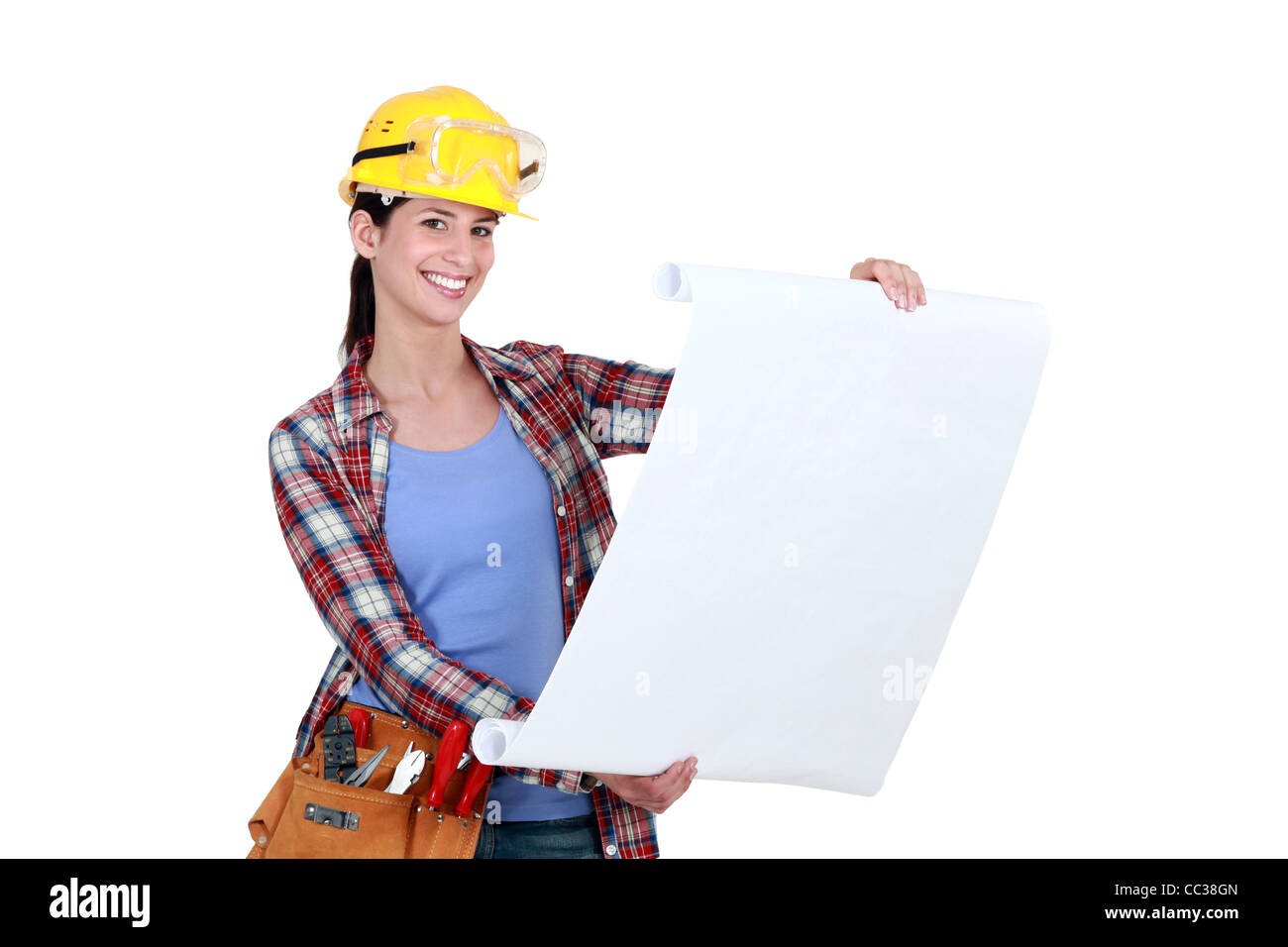 Tradeswoman examining a blueprint Stock Photo - Alamy
