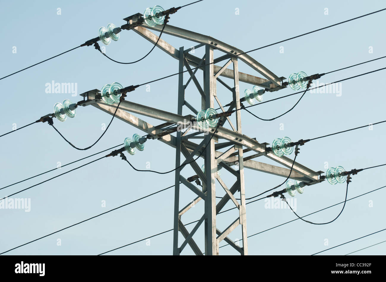 High voltage poles and wires on blue sky Stock Photo - Alamy