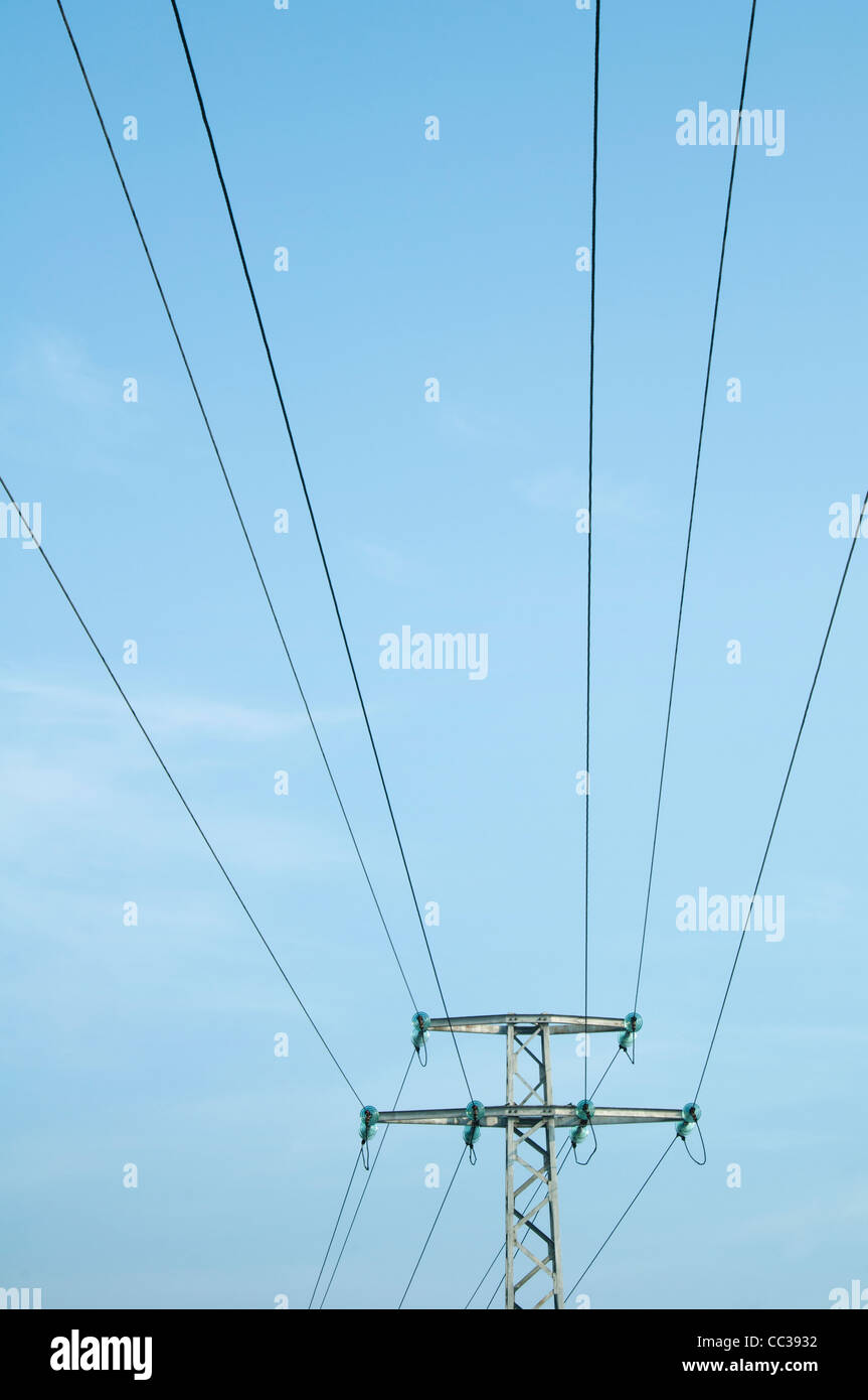 High voltage poles and wires on blue sky Stock Photo - Alamy