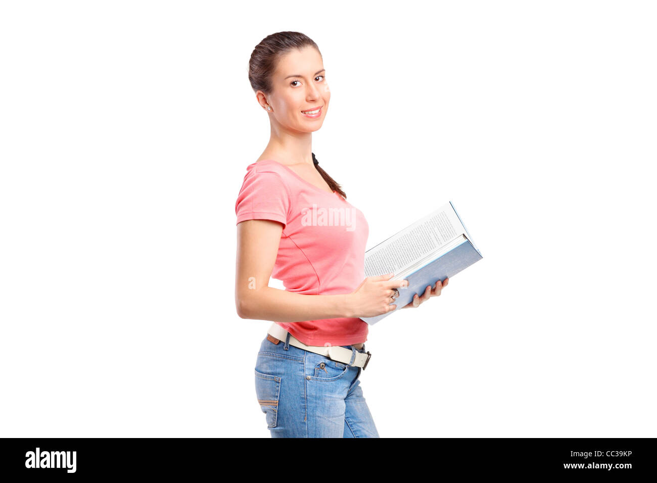 A school girl holding a book Stock Photo - Alamy