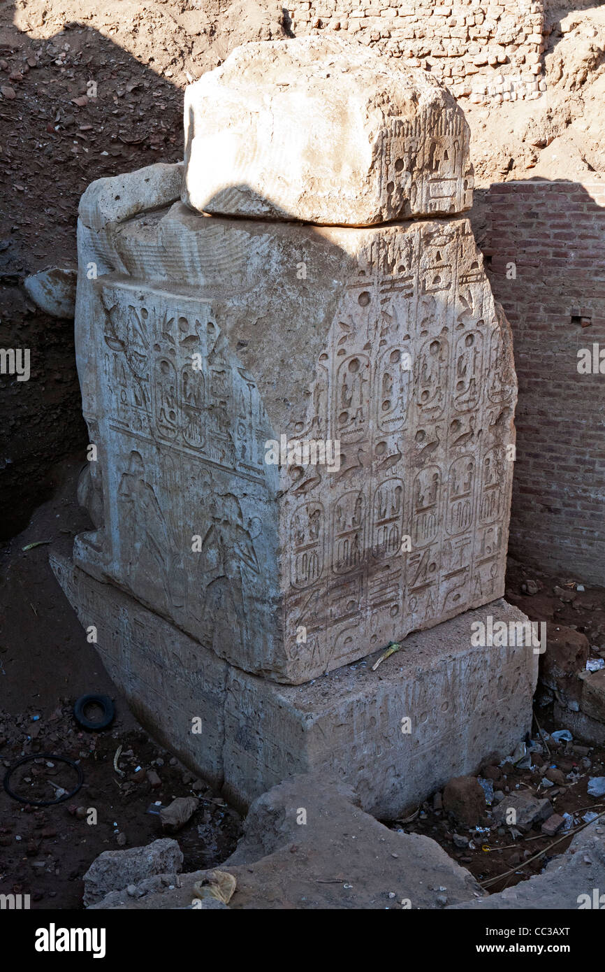 Seated statue base site of  unexcavated Ramesside period temple running under local cemetery at Akhmim near Sohag, Middle Egypt. Stock Photo