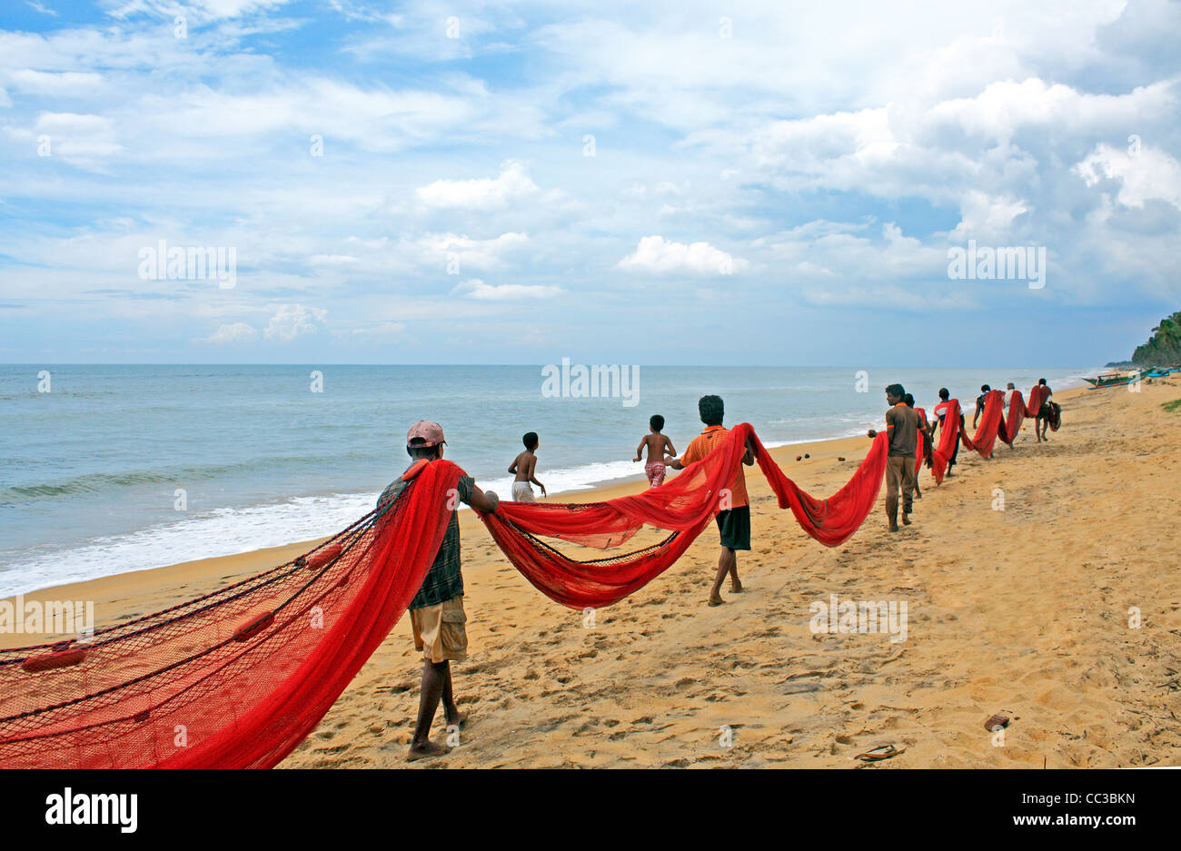 Fishermen Gathering Fishing Net on the Beach Wadduwa Sri Lanka Asia