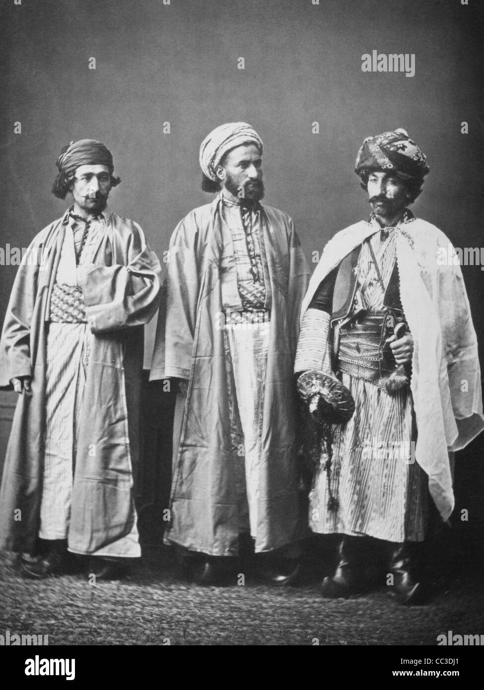 Studio portrait of models wearing traditional clothing from the province of Diarbèkir (Diyarbakır), Ottoman Empire Circa 1873 Stock Photo