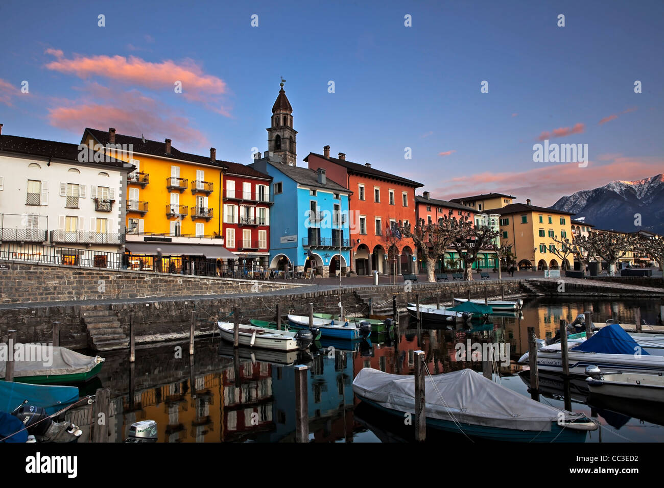 Lakefront in Ascona, Ticino, Switzerland in the evening in the foreground with the old port Stock Photo