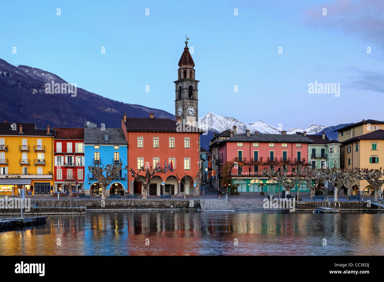Lakefront in Ascona, Ticino, Switzerland in the evening during the sunset with reflections in the Lago Maggiore. Stock Photo