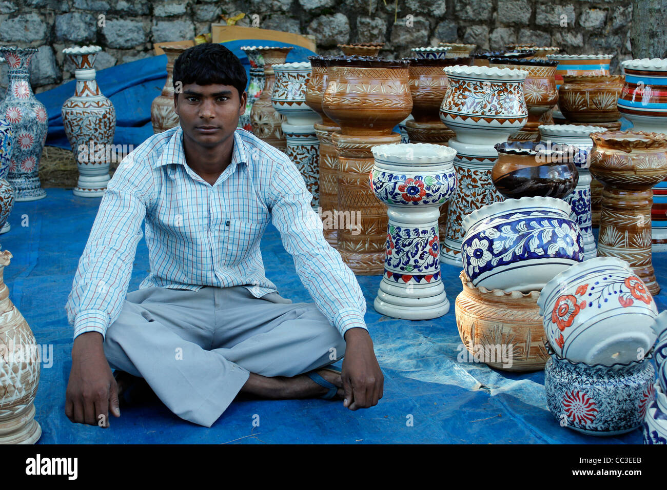 street vendor in India selling traditional ceramic crafts Stock Photo