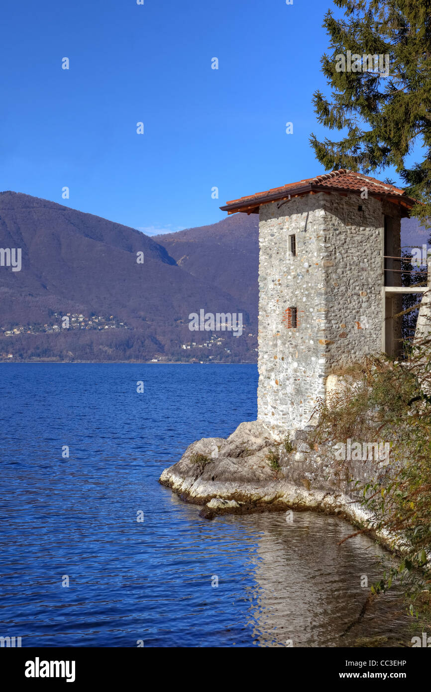 historical Roman Watchtower on the Lago Maggiore in Calde, Italy. Stock Photo