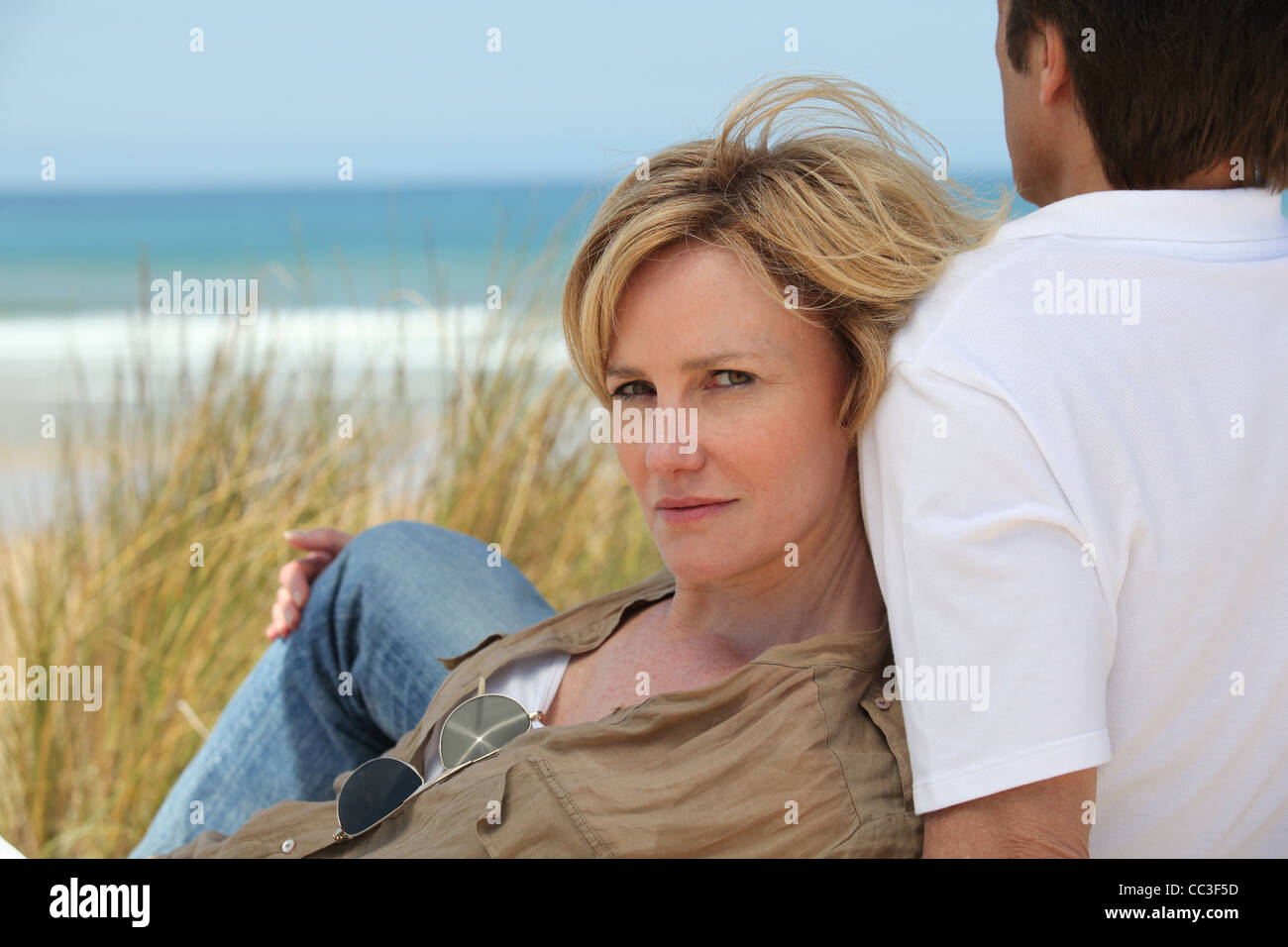 Couple on the dunes Stock Photo Alamy