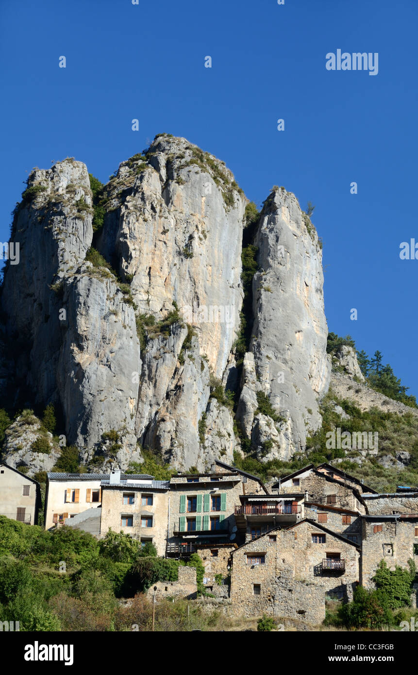 Rocky Landscape with the Perched Alpine Village of Roubion dominated by Cliffs & Rocky Outcrop in Mercantour National Park Alpes-Maritimes France Stock Photo