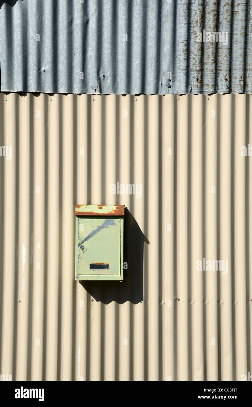 French Metal Letter Box, Postbox, Post Box, Mailbox, Mail Box or Collection Box Fixed to a Corrugated Iron Wall in Provence France Stock Photo