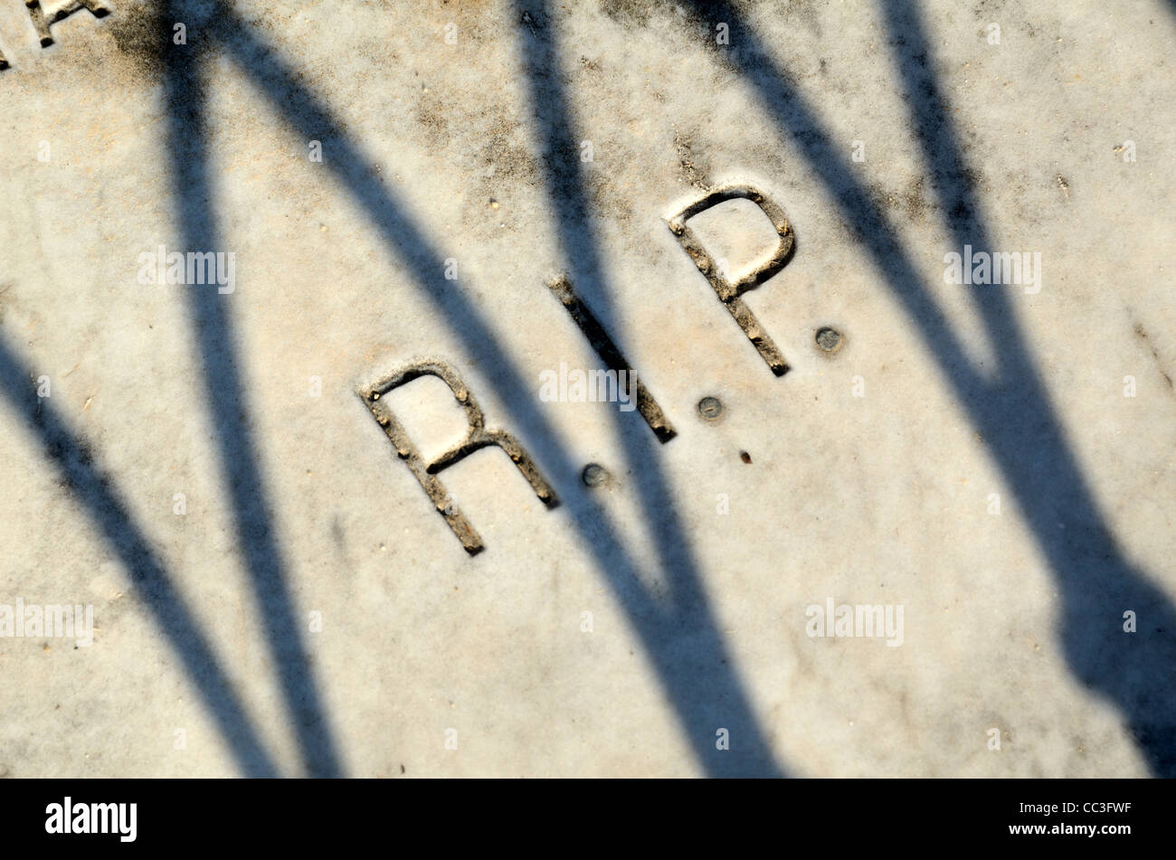RIP Rest in Peace written on a Tombstone, Grave or Tomb in the Old Cemetery, Graveyard or Cimitière du Vieux Château Menton France Stock Photo
